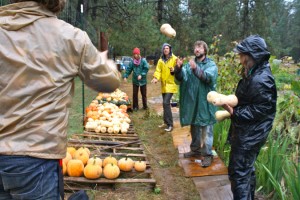 Look at this picture from this same date last year. Totally raining. And look at all those unprepared and inappropriately dressed farmers! Turns out that tossing squash during the first rain is just as much fun as jumping in puddles!